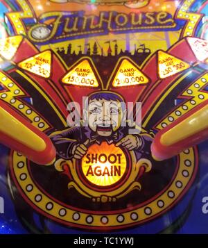 Detail close up of vintage pinball playfield artwork for circus-themed 'Funhouse' machine with Ventriloquist dummy and 'Shoot Again' light, April 17, 2019. () Stock Photo