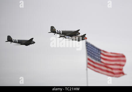 Douglas C-47 Skytrain aircraft take to the skies above the Imperial War Museum Duxford as part of the attraction's D-Day 75 anniversary week of events. Stock Photo