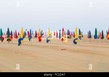 The famous colorful parasols on Deauville beach, Normandy, France Stock Photo