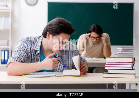 Two male students in the classroom Stock Photo