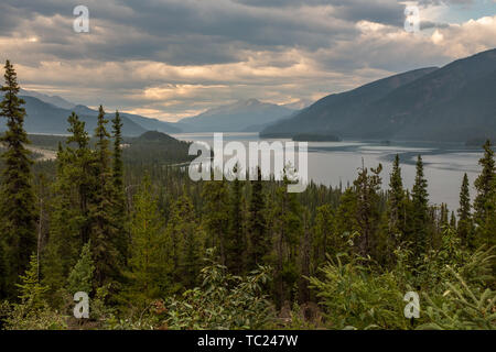 A view from the road of the beautiful Muncho Lake in Canada framed by the pine forests, nobody in the image Stock Photo