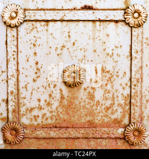 square metal frame with a pattern on a rusty wall. fence. background. texture. Stock Photo