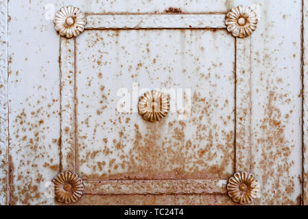 square metal frame with a pattern on a rusty wall. fence. background. texture Stock Photo