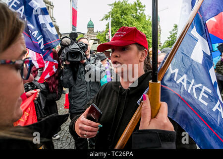 Former Belfast Councillor Jolene Bunting in heated discussion during a corner protest with supporters at a 'Stop Trumpism' rally hosted by ExAct: Expat Action Group NI, at Belfast City Hall. Stock Photo