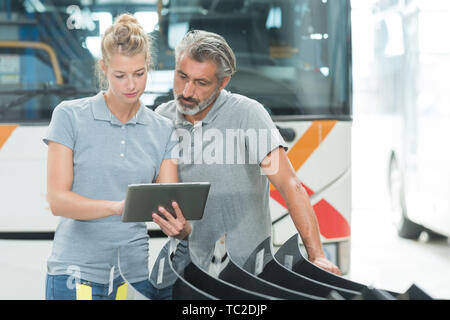 mechanics using a digital tablet Stock Photo