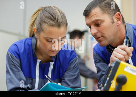 team of young female and male engineers working on projects Stock Photo