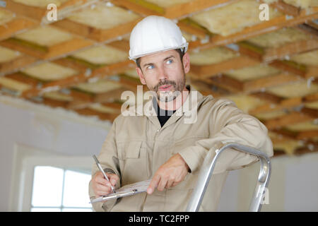 man working on ladder Stock Photo