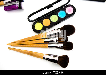 Makeup cosmetics on white background. Top view with copy space. Beauty tools palettes collection Stock Photo