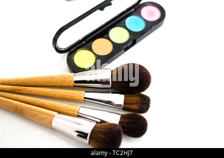 Makeup cosmetics on white background. Top view with copy space. Beauty tools palettes collection Stock Photo