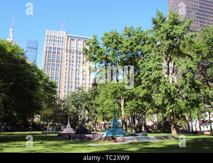 New York, USA. 03rd June, 2019. For a new installation in New York's Madison Square Park, artist Leonardo Drew has placed a small metropolis on a kind of carpet in the grass. The sculpture created especially for the park in the middle of Manhattan, which was opened on the night of Tuesday (04.05.2019), consists of various materials, including colored sand, and is reminiscent of a city on a flying carpet. Credit: Christina Horsten/dpa/Alamy Live News Stock Photo