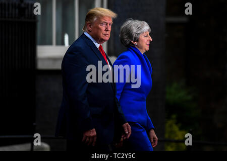 Beijing, Britain. 4th June, 2019. U.S. President Donald Trump (L) and British Prime Minister Theresa May leave 10 Downing Street in London, Britain, on June 4, 2019. Credit: Alberto Pezzali/Xinhua/Alamy Live News Stock Photo