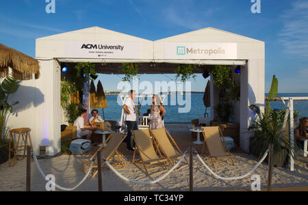 Cannes, France - June 04, 2019: MIDEM, the International B2B Music Market with general Atmosphere at the Beach. Strand, Meer, Sea, Business | usage worldwide Stock Photo