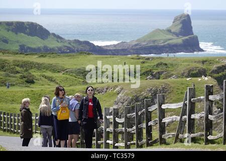 Gower, Swansea, Wales, UK. 5th June 2019. Weather: A lovely sunny day with a blustery wind met visitors at National Trust Rhosili (correct,1's') on the Gower peninsula, south Wales. The headland reserve area affords spectacular views of Rhossili (correct, 2's') Bay and the iconic promontory of Worms Head. More showery conditions are forecasting.  Credit: Gareth Llewelyn/Alamy Live News Stock Photo