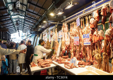 April 28, 2019. Athens, Greece. Greek meat market concept. Whole and half certified lambs are sold, out of store. Stock Photo