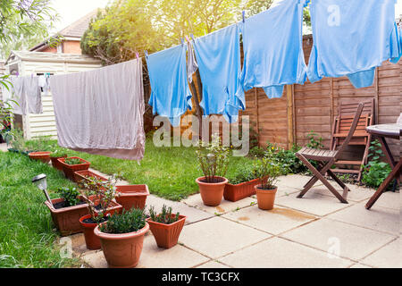 Laundry on washing lines. Drying laundry, Cloths are hanging on clothesline Stock Photo