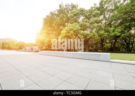 Empty marble floor near green forest Stock Photo