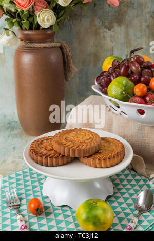 Moon cakes and fruit on the table Stock Photo