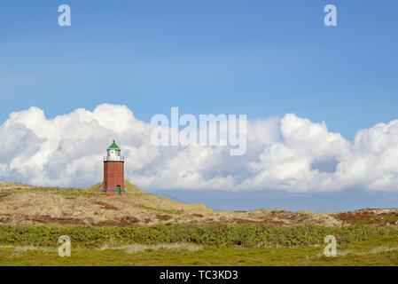 Small lighthouse in dunes, cross light red cliff with cloudy sky, Kampen, Sylt, North Frisian Islands, North Frisia, Schleswig-Holstein, Germany Stock Photo