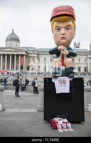 A sculpture of Donald Trump tweeting on a toilet appears in front of the National Gallery at the Trafalgar Square during the anti-Trump rally on the second day of the state visit of the American president to the UK.