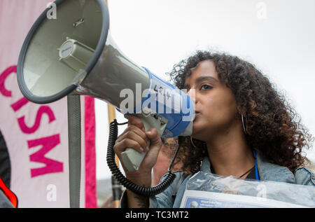 A protester chants with a megaphone during an anti-racism protest at ...
