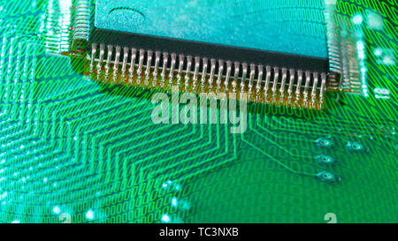 Integrated circuit. Surface-mount technology of electronic components. Digital collage. Microchip on green PCB with abstract texture from many zeros. Stock Photo