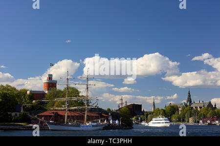 Brig Tre Kronor at Kastellholmen, Stockholm, Sweden, with Vasa Museum and Nordic Museum in the background Stock Photo