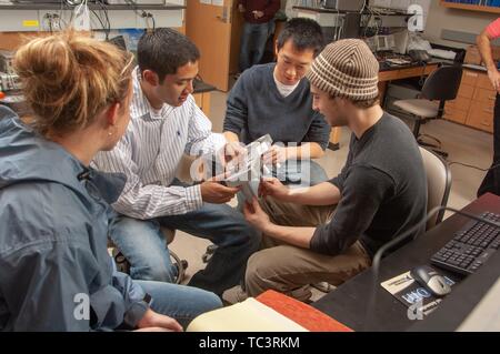 A small group of Biomedical Engineering and Innovation Design students work together at the Johns Hopkins University, Baltimore, Maryland, February 12, 2007. From the Homewood Photography Collection. () Stock Photo