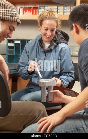 A small group of Biomedical Engineering and Innovation Design students work together at the Johns Hopkins University, Baltimore, Maryland, February 12, 2007. From the Homewood Photography Collection. () Stock Photo