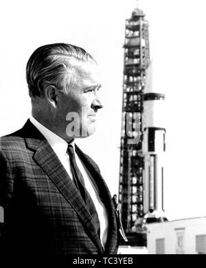Dr Wernher von Braun stands in front of a Saturn IB launch vehicle at John F Kennedy Space Center, Merritt Island, Florida, 1968. Image courtesy National Aeronautics and Space Administration (NASA). ()
