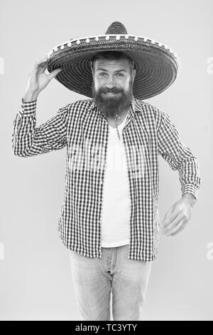 Mexican bearded guy ready to celebrate. Customs and traditions. Man wear sombrero mexican hat. Vacation travel festival and holidays. Join fest. Mexican culture concept. Celebrate mexican holiday. Stock Photo