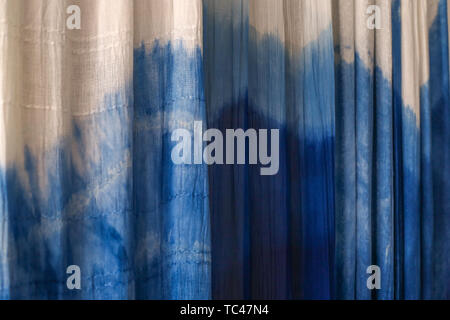 Batik braid glowing dots abstract background Stock Photo