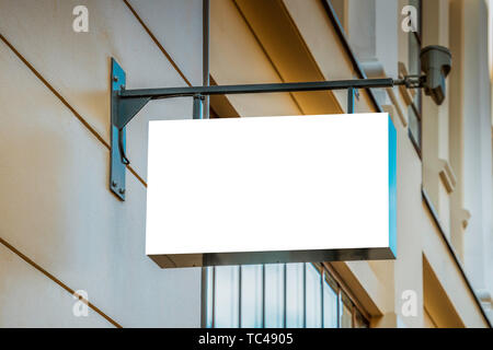 Mock up. Blank white signboard on classical architecture building. Stock Photo