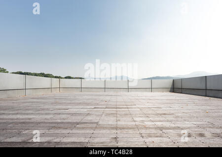 empty marble floor with beautiful lake in blue sky Stock Photo
