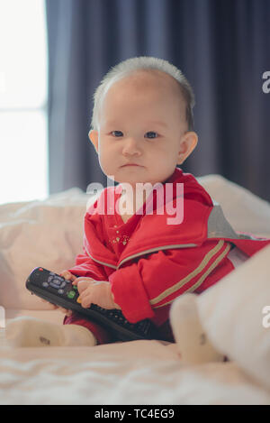 Nine-month-old toddler takes photo on cruise ship trip Stock Photo