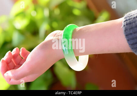 Jade bracelet wearing picture Stock Photo: 248512037 - Alamy