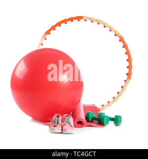 Set of sports equipment with fitness ball and shoes on white background Stock Photo