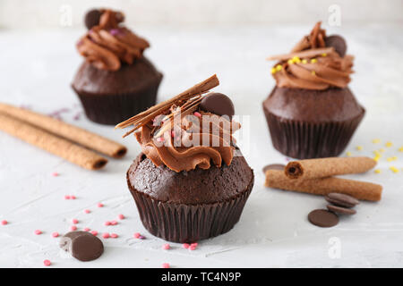 Tasty chocolate cupcakes on light background Stock Photo