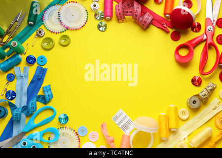 Frame made of sewing threads and accessories on grunge background Stock ...
