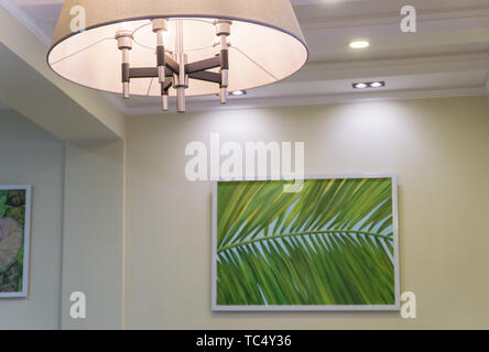 lamp on the ceiling and painting on the wall. interior of a fashionable restaurant Stock Photo