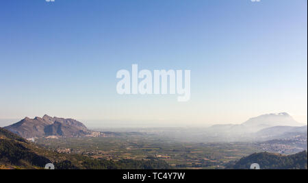 Panoramic view of Rectoria Valley in Marina Alta region, Alicante, Spain. View from Vall de Laguar town. Segaria and Montgó mountains are in the backg Stock Photo