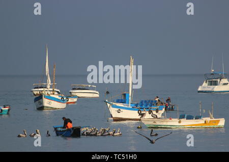 small fisher boats in the ocean in peru Stock Photo