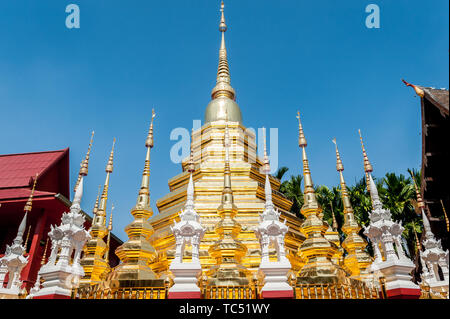 A shot looking across to the detailed ornate gold design of the beautiful Thai Temple Wat Phantao in Chiang Mai Thailand.