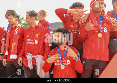 2nd June 2019 , Liverpool, England; UEFA Champions League, Liverpool FC Champions League winners celebrations and open top bus parade ; Mohamed Salah (11) of Liverpool with the sign of victory    Credit: Mark Cosgrove/News Images Stock Photo