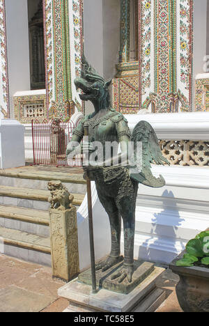 Statue in the Wat Phra Kaew, Temple of the Emerald Buddha in Bangok, Thailand. Stock Photo