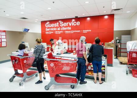 Miami Florida,Wynwood,Target discount department store,inside interior,guest services returns exchanges,customers,shopping carts trolleys,man men male Stock Photo