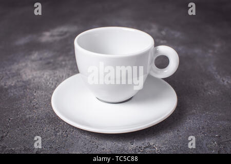 Empty White Espresso Coffee Cup on Dark Background Stock Photo