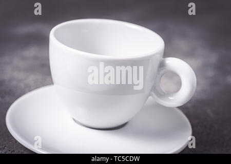Empty White Espresso Coffee Cup on Dark Background Stock Photo