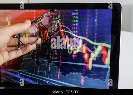 businessman shows the screen on laptop the graph of growth Stock Photo
