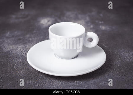 Empty White Espresso Coffee Cup on Dark Background Stock Photo