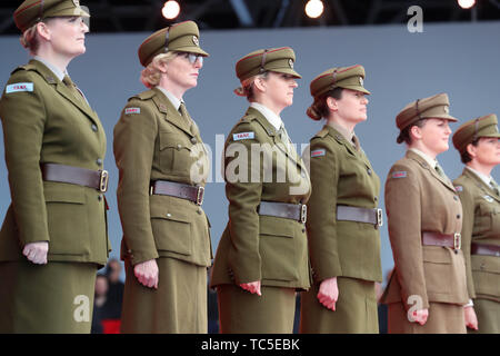 Members of the First Aid Nursing Yeomanry on stage during commemorations for the 75th Anniversary of the D-Day landings at Southsea Common, Portsmouth. Stock Photo